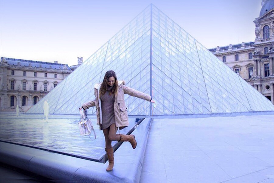 no tourist photo of girl dancing on louvre